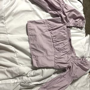 a purple long sleeve tight t shirt